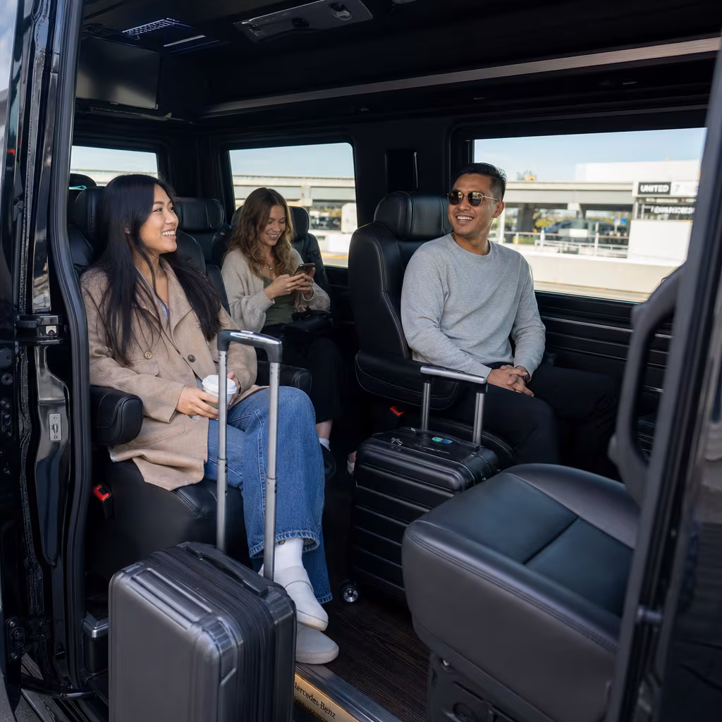 Passengers loading luggage while boarding an San Francisco group shuttle