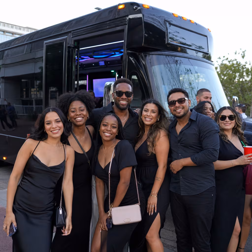 Group boarding a white charter bus for Birthday Transportation transportation in San Francisco