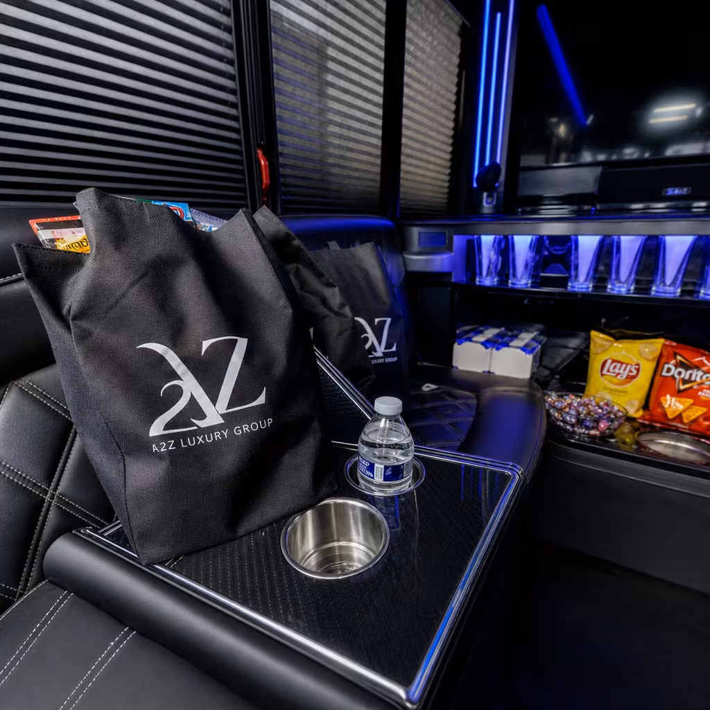 Party bus interior with wraparound leather seating and LED lighting in San Francisco